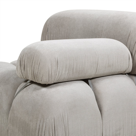 Close-up of the armrest on the 36' modern gray lounge arm chair, showcasing plush corduroy texture and modular attachment detail.