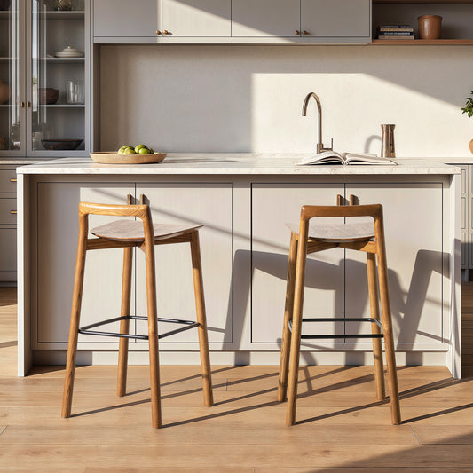 Pair of Sven 30' dark brown modern low back wood barstools in a bright kitchen with light cabinetry and wood flooring.