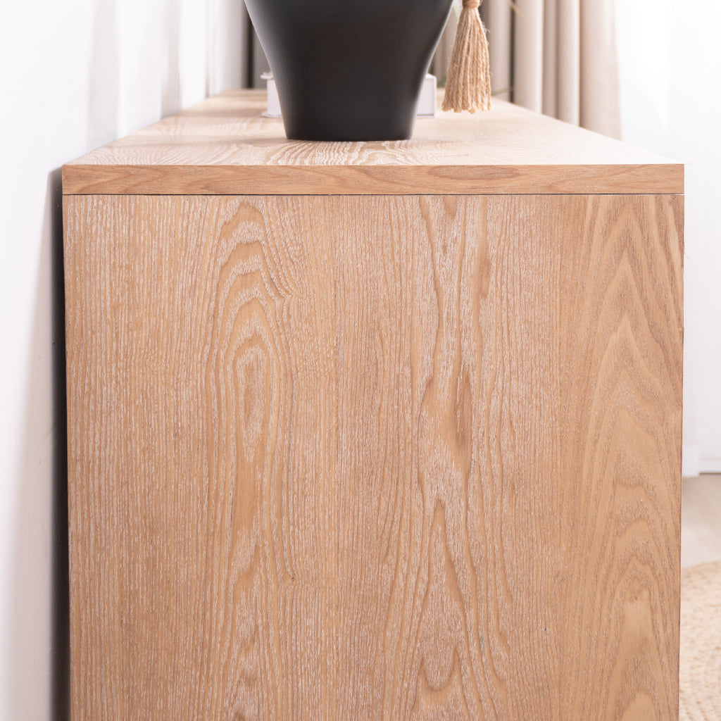 Close-up of the wood grain texture on the side of the rustic console table, emphasizing its natural finish and craftsmanship.