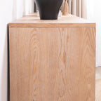 Close-up of the wood grain texture on the side of the rustic console table, emphasizing its natural finish and craftsmanship.