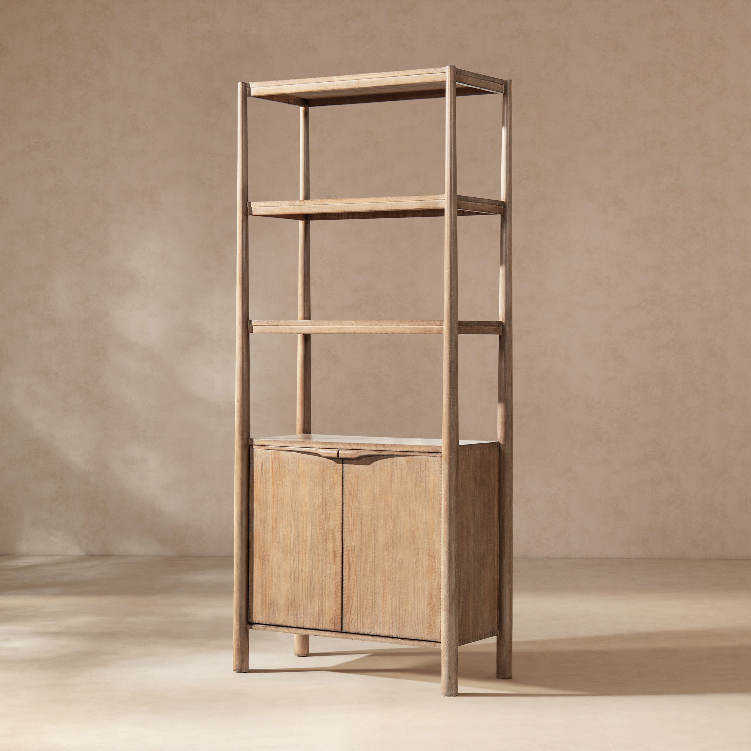 Tall antique natural reclaimed pine bookshelf featuring three open upper shelves and a two-door lower storage cabinet.