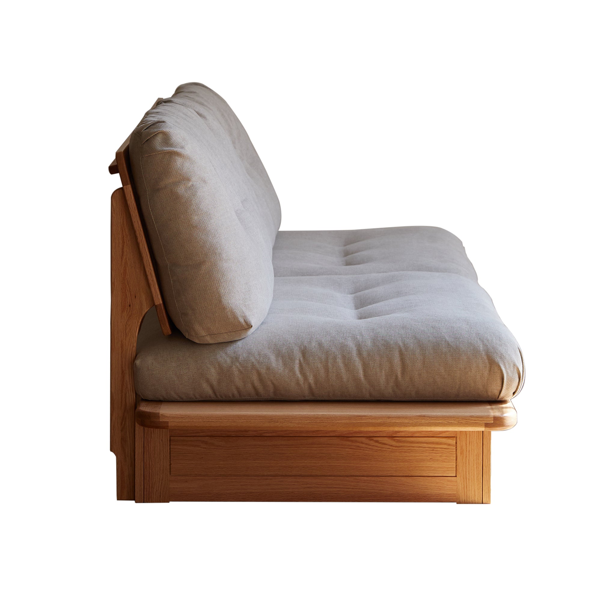 Side view of solid wood sofa with plush beige cushions, highlighting premium oak frame and ergonomic seating depth.