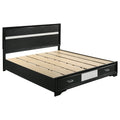 California king black wood storage bed with silver-toned glitter accents, built-in footboard drawers, and wood slats.