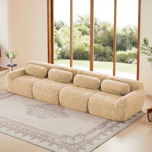 149'' Modular Plush Sofa in light khaki with non-slip bottom, shown in a modern living room with large windows and neutral decor.