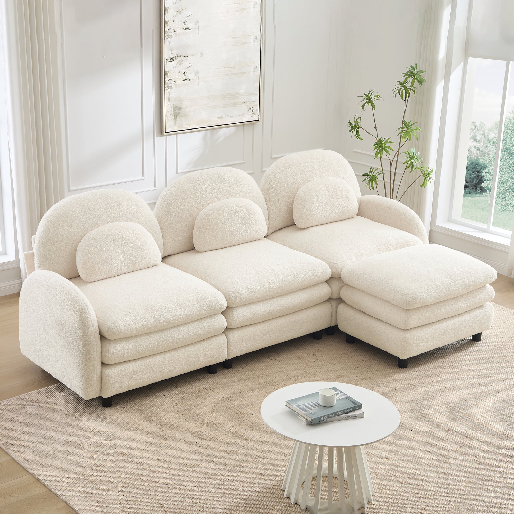 Beige teddy fabric 3-seater sectional sofa with curved back, lumbar pillows, layered cushions, and a movable ottoman.