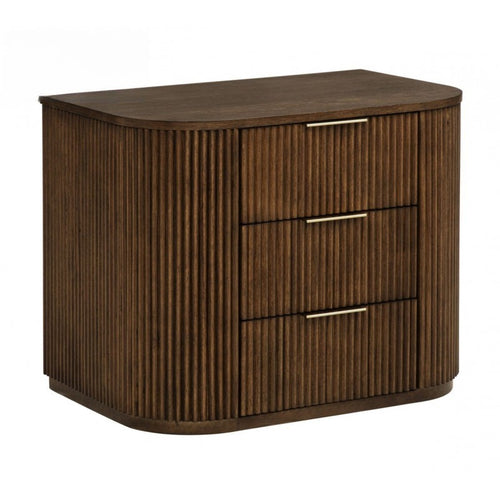 Modern brown solid wood nightstand with a fluted texture, curved sides, and three drawers featuring slim gold handles.
