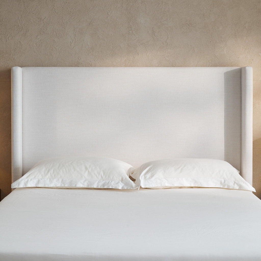 Hosford Minimalist Upholstered Wingback Bed.