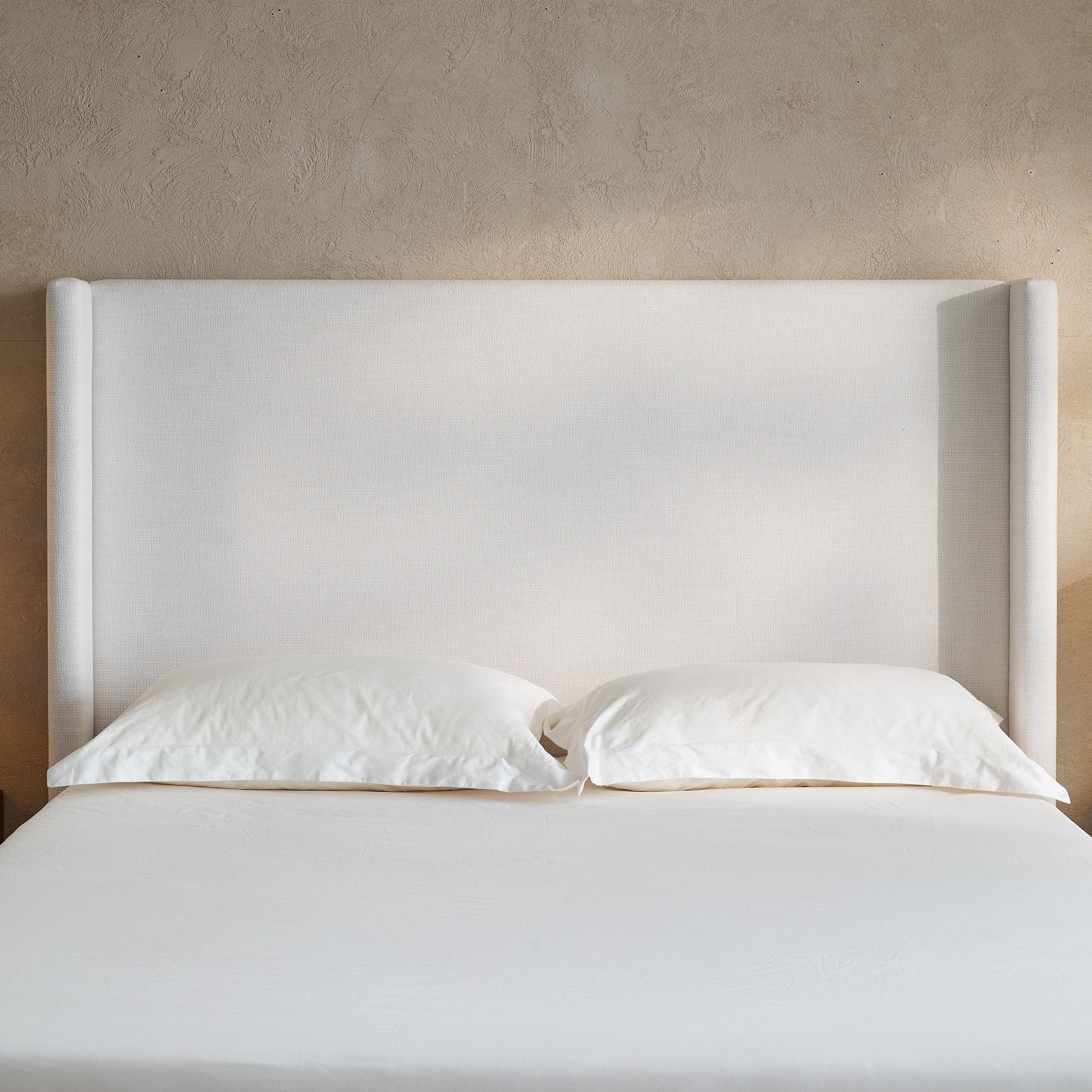 Hosford Minimalist Upholstered Wingback Bed.