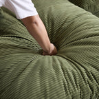 Green Corduroy Sofa with Cushions and Pillows.