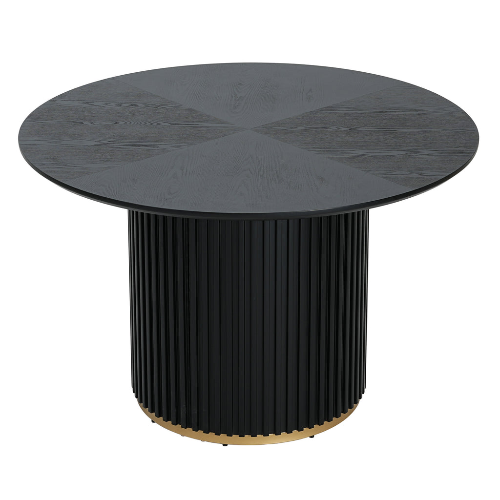 Round pedestal dining table in black with fluted base and gold accent. Seats 4, made of MDF and iron for modern dining spaces.