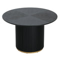 Round pedestal dining table in black with fluted base and gold accent. Seats 4, made of MDF and iron for modern dining spaces.