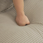 Brown Corduroy Modular Sofa - Adjustable Pillows | Durable hand pressing into soft cushion to demonstrate plushness and comfort level.