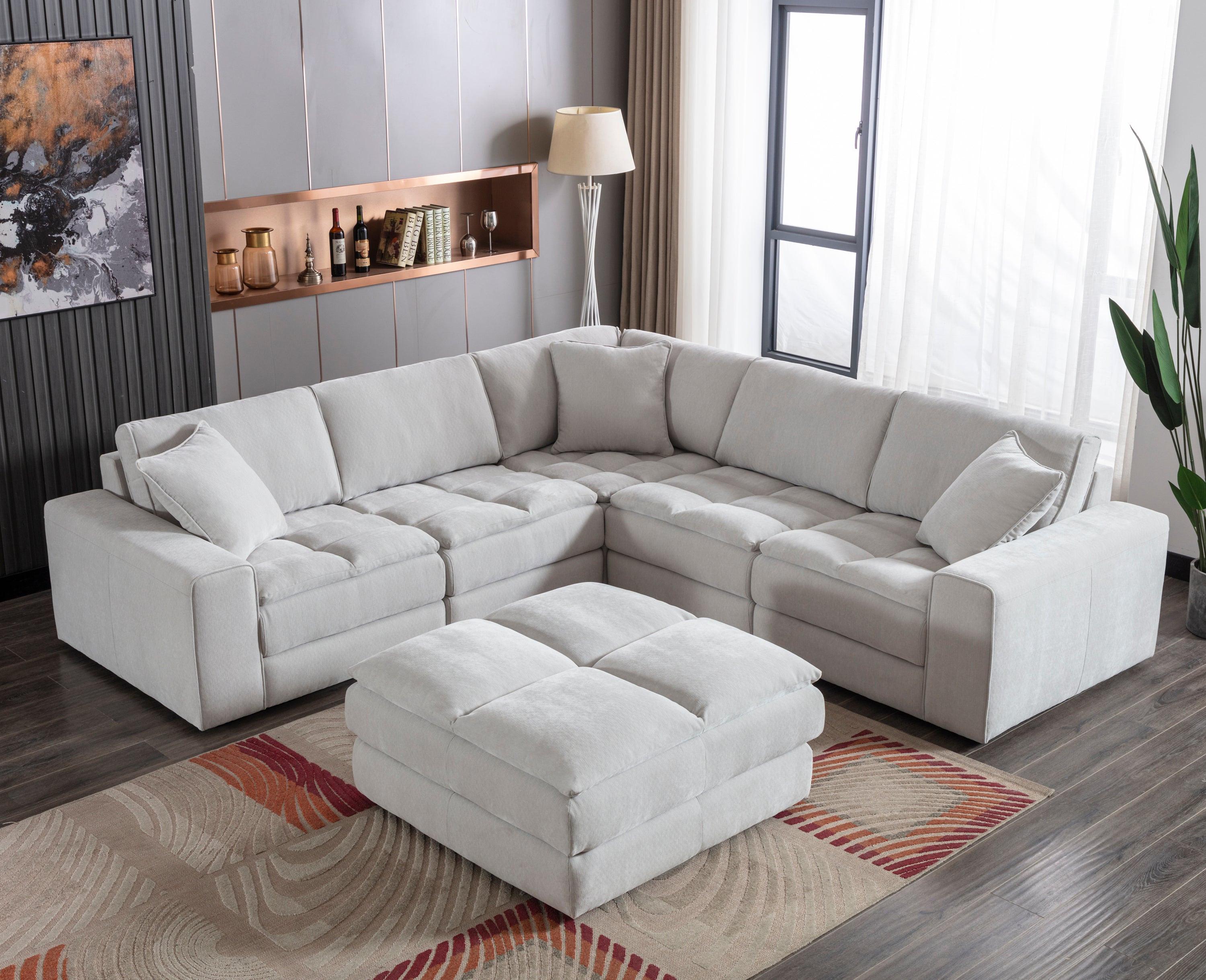 Breton Modular Sectional Sofa with Ottoman in Oyster Grey.