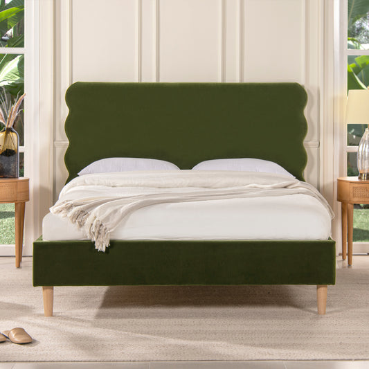 Stockholm Modern Wavy Headboard Platform Bed in queen size with olive green velvet upholstery and wooden legs, styled in a modern bedroom.