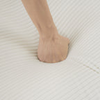 Hand pressing into cushion of Modular Corduroy Sofa Beige - Stylish and Comfortable, showing high-density foam softness.