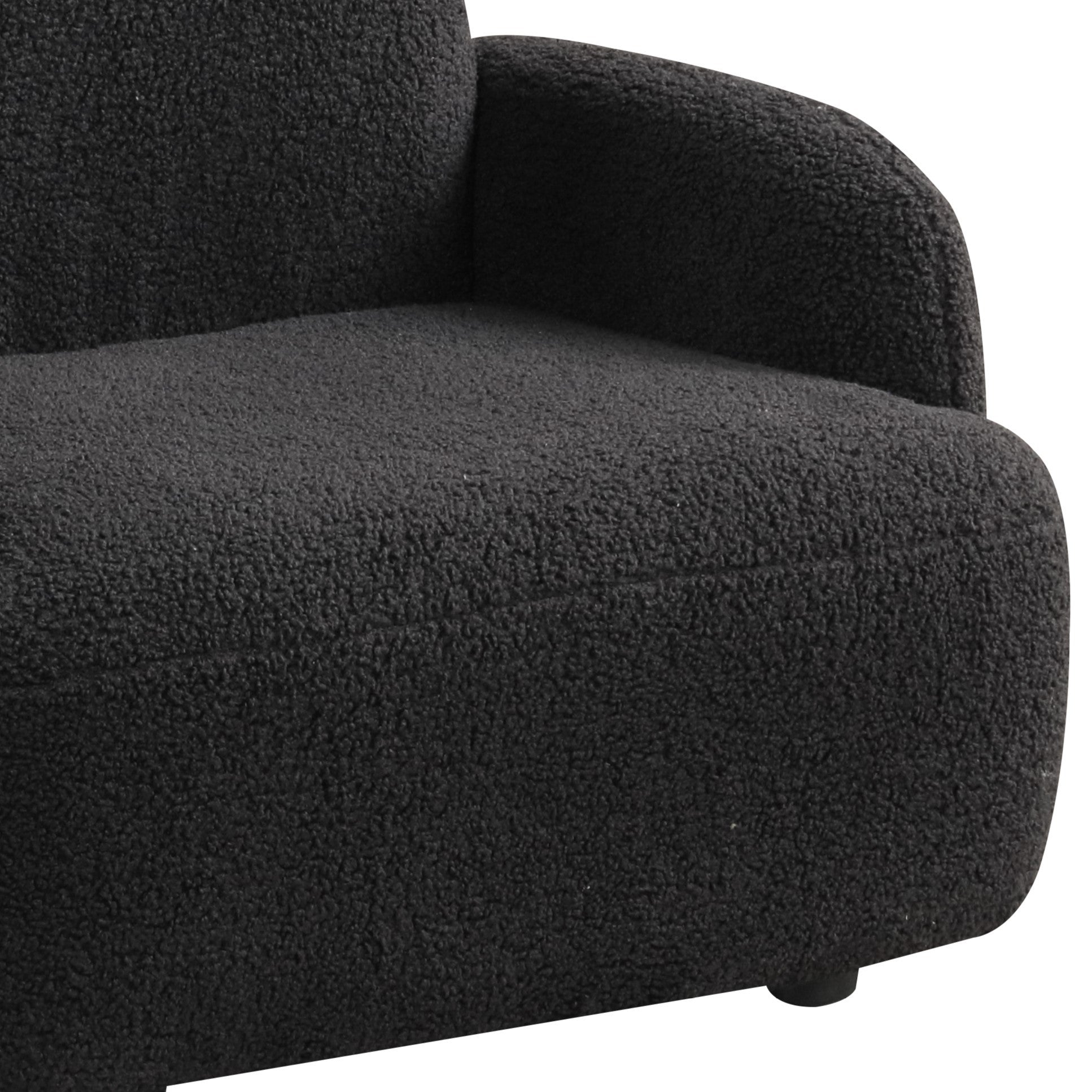 Detail of Black Sherpa Bear-Shaped Kids Armchair seat with thick foam cushioning and soft sherpa fabric for maximum comfort.