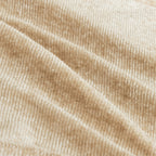 Close-up of beige velvet fabric texture used in Velvet L Shape Modular Sofa, highlighting its soft, luxurious finish.