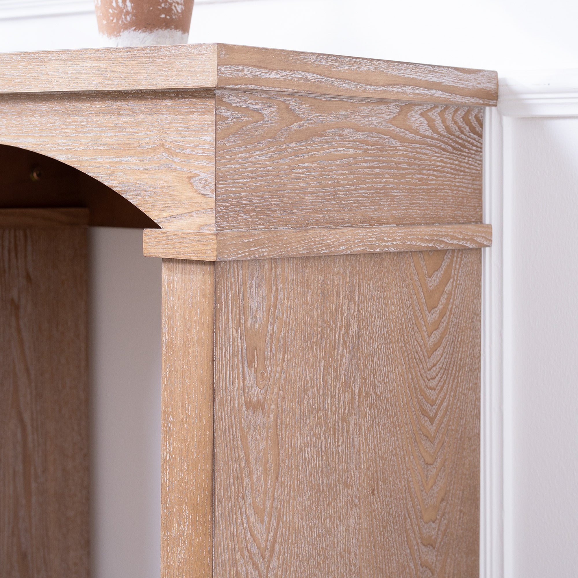 Close-up of the Rustic Archway Console Table's corner, showing detailed wood grain and hand-painted finish.