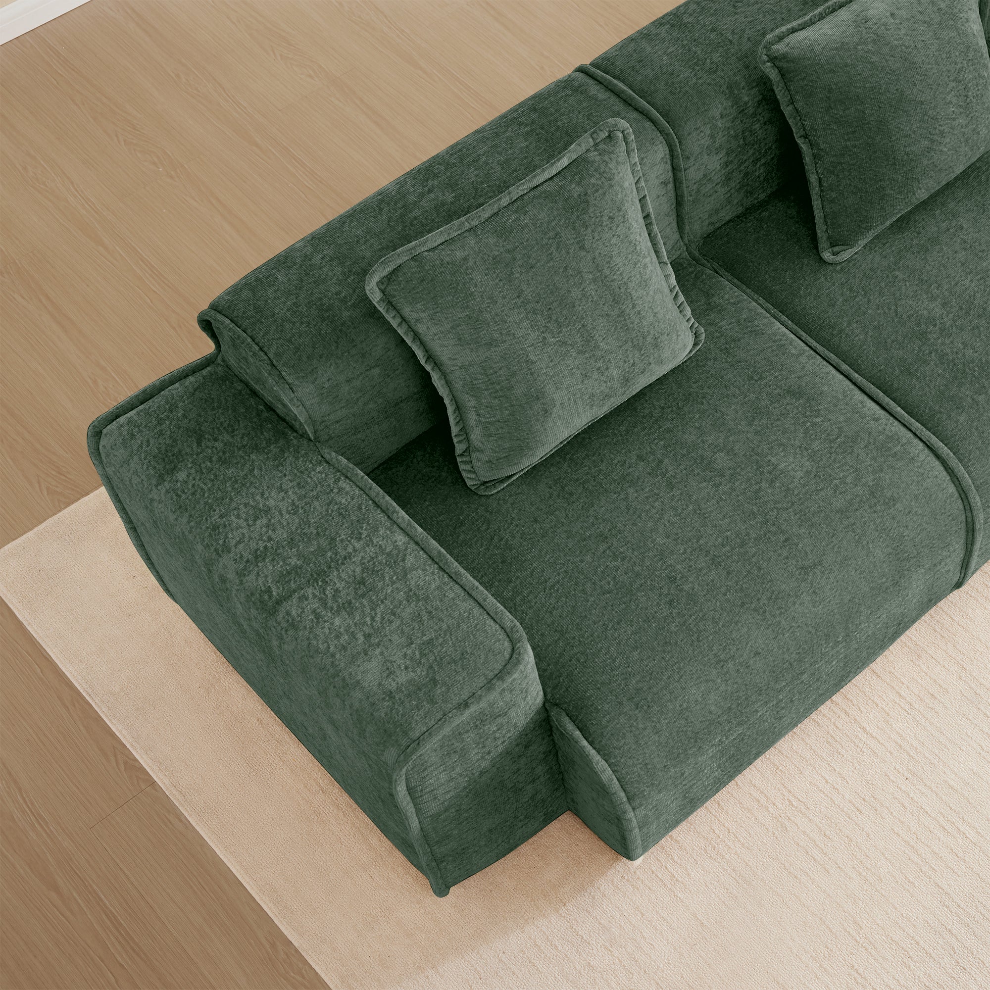 Top view of the Velvet Modular U Shape Sofa armrest and cushion, highlighting its soft velvet texture and modular design.