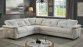 Contemporary beige reversible sectional sofa with a wooden frame, quilted accents, and elegant gold-tone metal base.