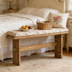 Rustic wooden console bench with a floral cushioned seat, featuring a natural wood finish and sturdy jointed legs.