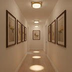 Antique Brass LED Flush Mount Light Fixtures installed in a hallway, casting warm, focused light pools beneath each fixture.