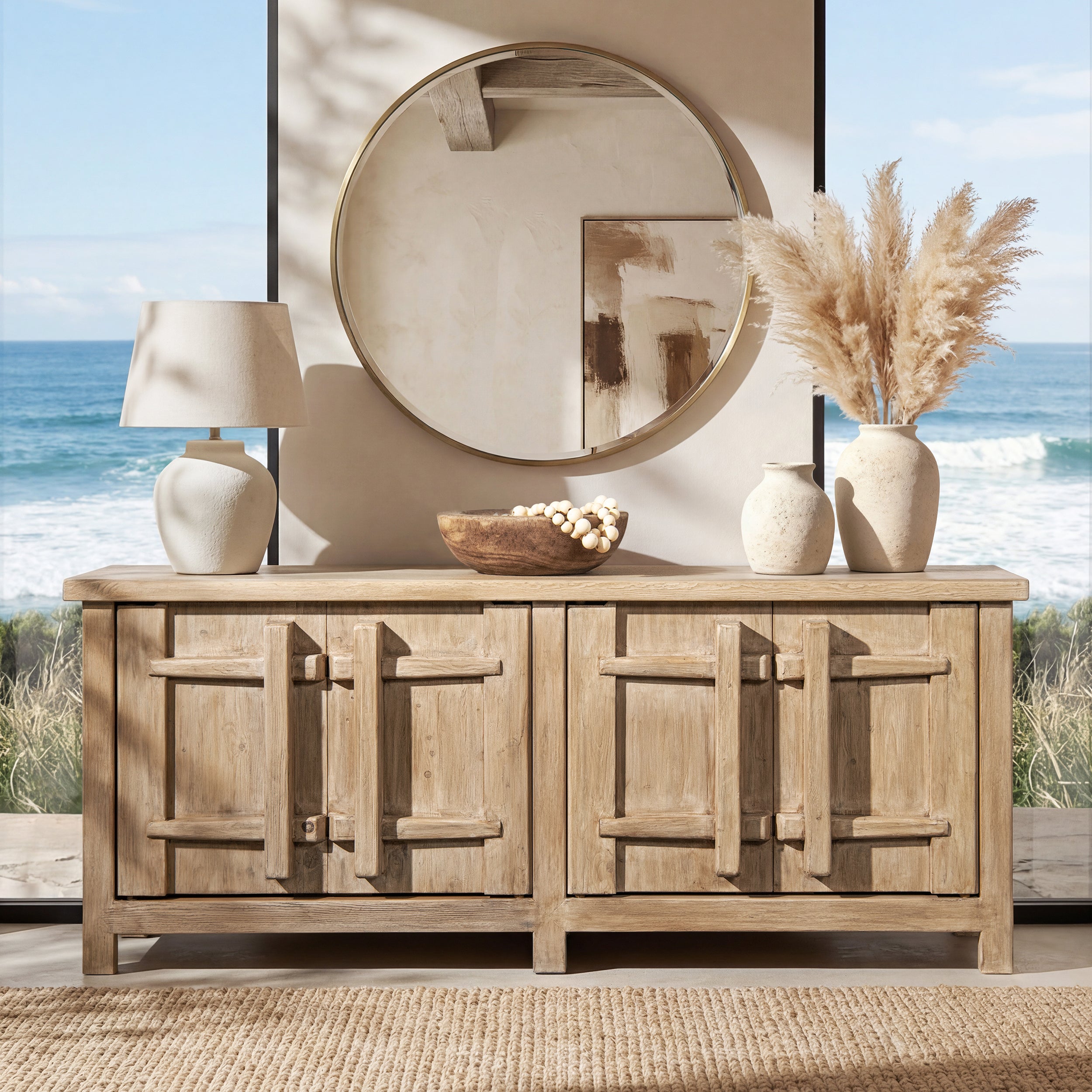 Natural light brown reclaimed pine sideboard with four doors featuring rustic crossbar details in a coastal setting.