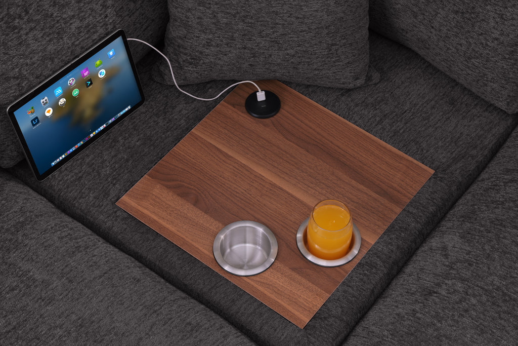 Close-up of built-in wood tray with USB charging port and dual cupholders on gray chenille sectional sofa, showcasing tech convenience.