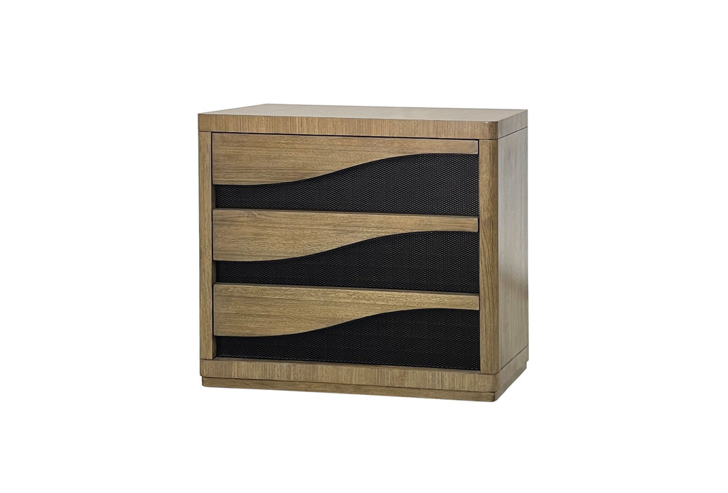 Angled view of Eucalyptus Bachelors Chest showcasing natural wood finish and three soft-close drawers with black wave accents for stylish storage.
