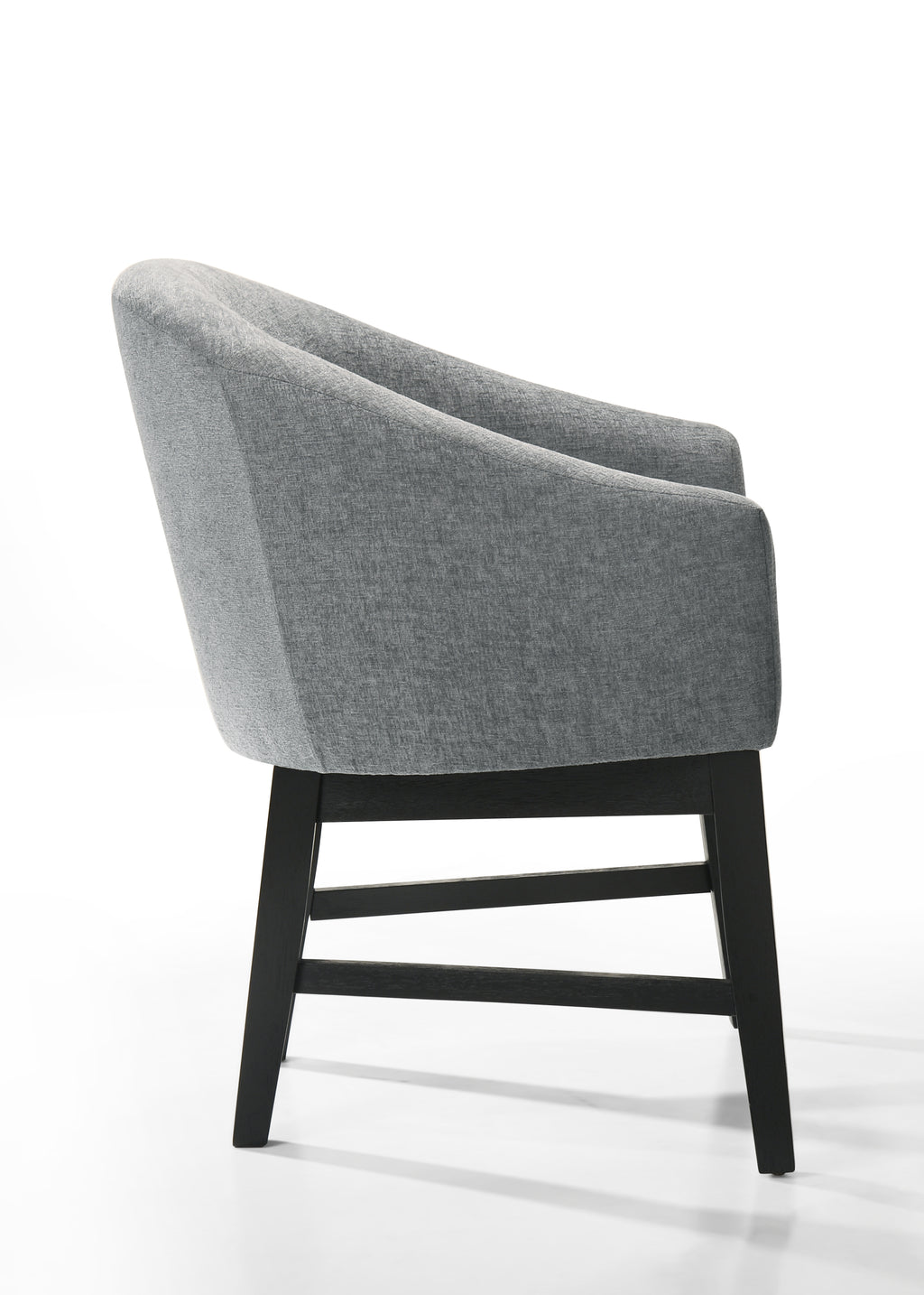 Side profile of Haven 7Pc Dining Set - Round Ebony gray barrel chair highlighting its ergonomic curve and modern black wood legs.