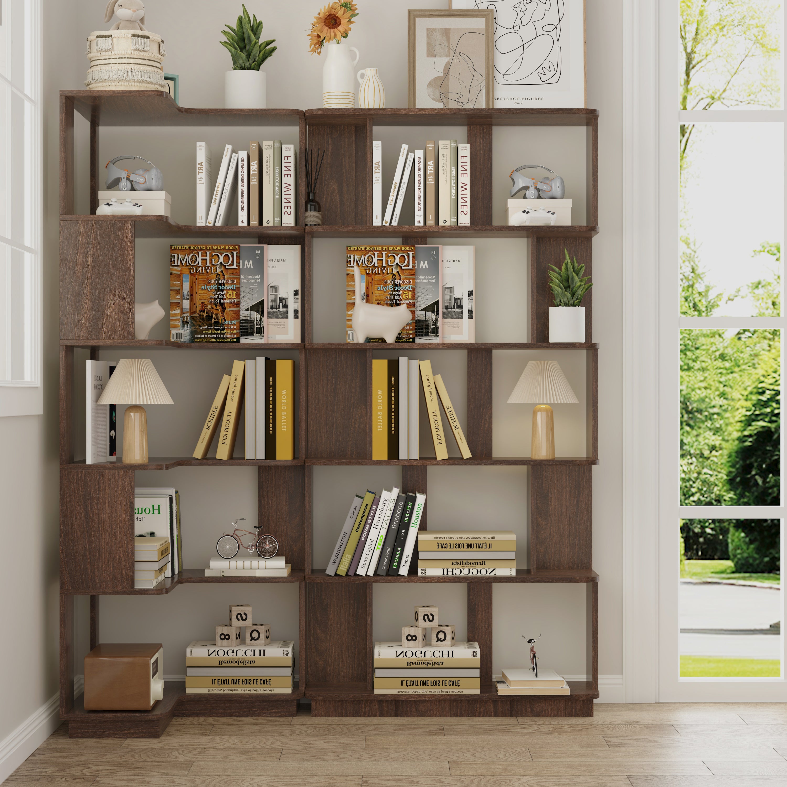 Dark brown wooden L-shaped and I-shaped modular bookcase set with open shelves styled with books, lamps, and decor.