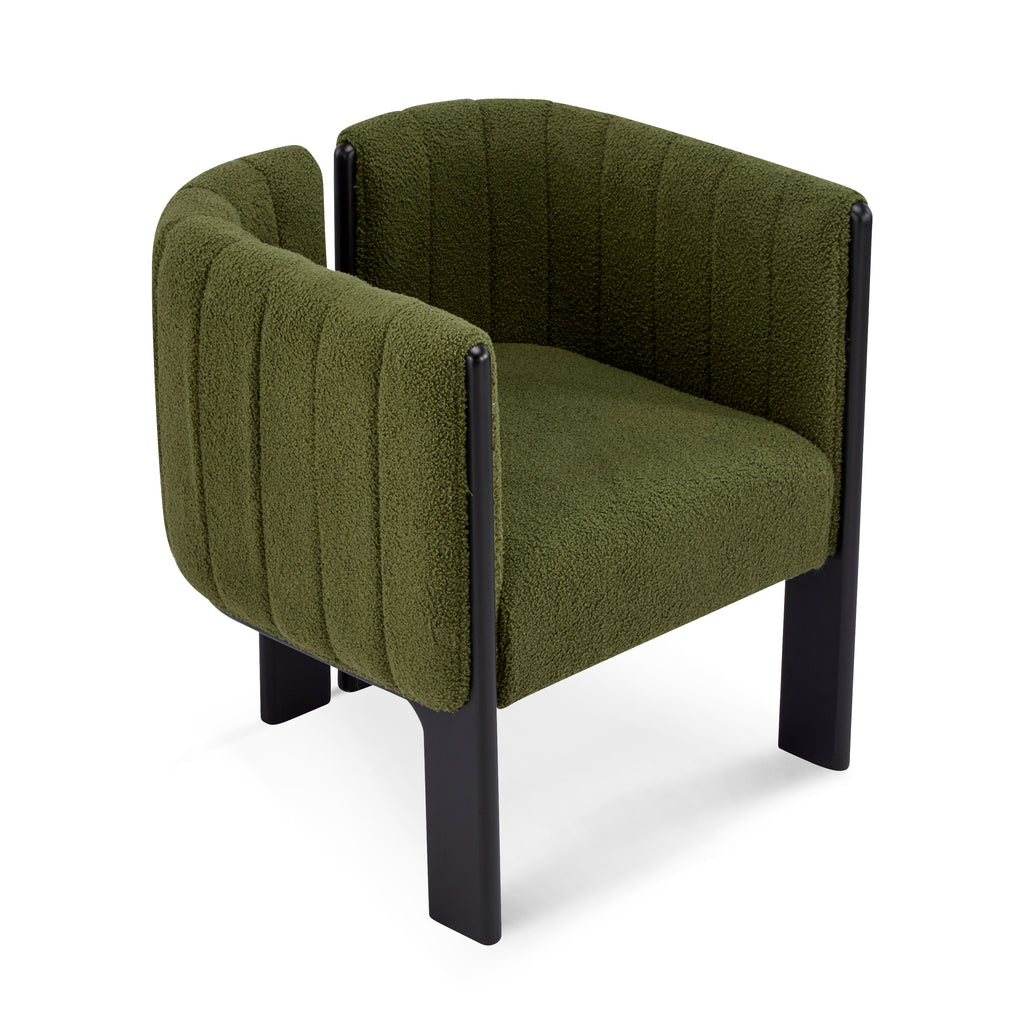 Side angle of modern dining chair in olive green boucle fabric with black legs, showcasing its curved backrest and contemporary design.