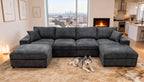 Charcoal grey textured fabric sectional sofa with two matching ottomans, square toss pillows, and a husky on a rug.