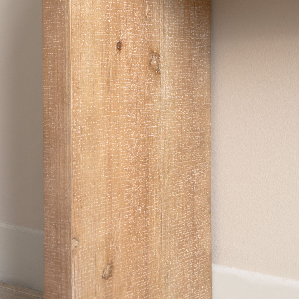 Close-up of leg panel on Slim Natural Wood Console Table, highlighting natural wood knots and textured finish.