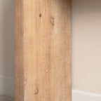 Close-up of leg panel on Slim Natural Wood Console Table, highlighting natural wood knots and textured finish.