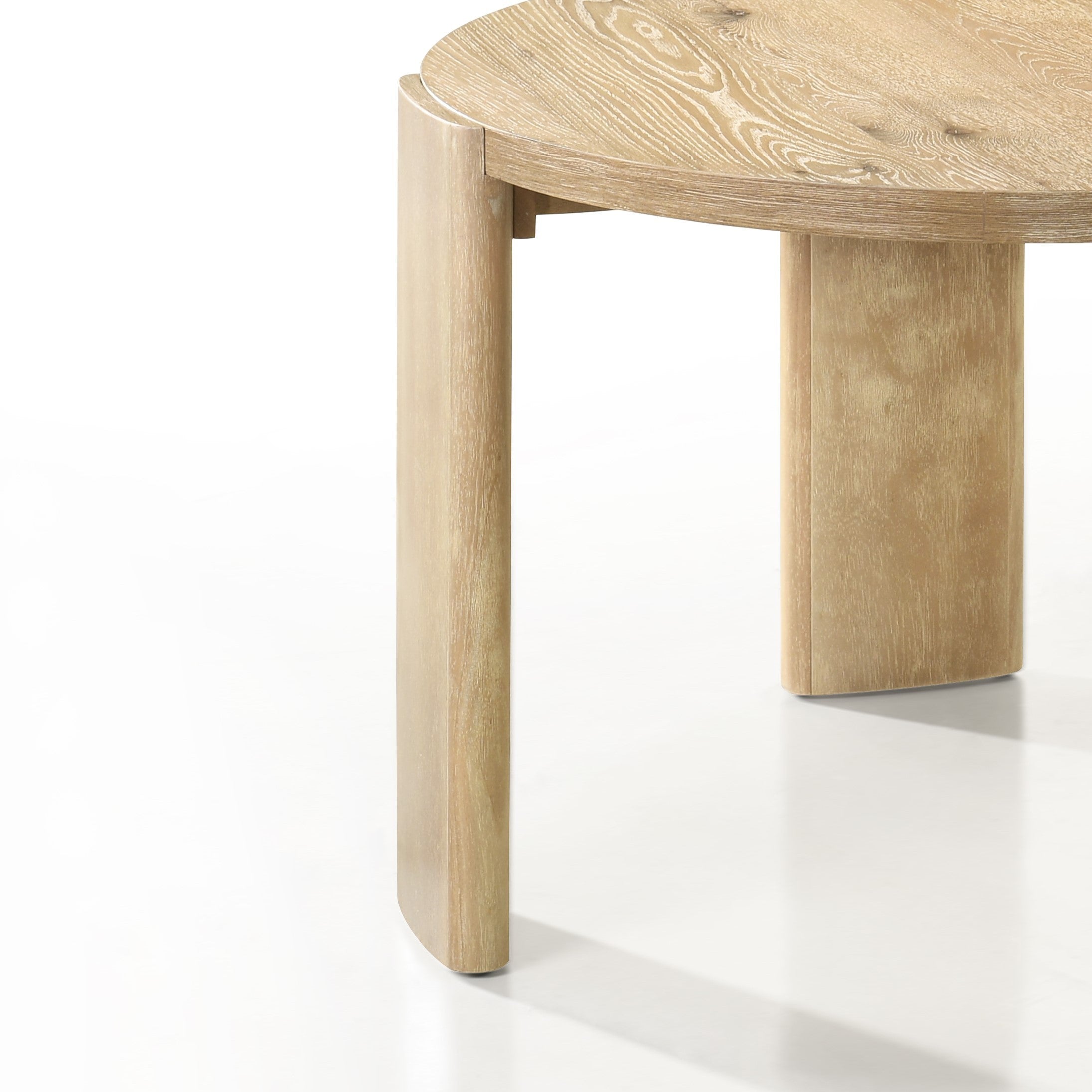 Detailed view of Bowen Oak Finish Table leg design, featuring curved solid rubberwood construction and natural oak finish.