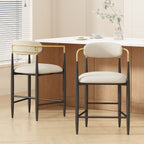 Modern counter stools set of 2 with beige upholstery, black iron legs, and gold open-back accents in a stylish kitchen setting.