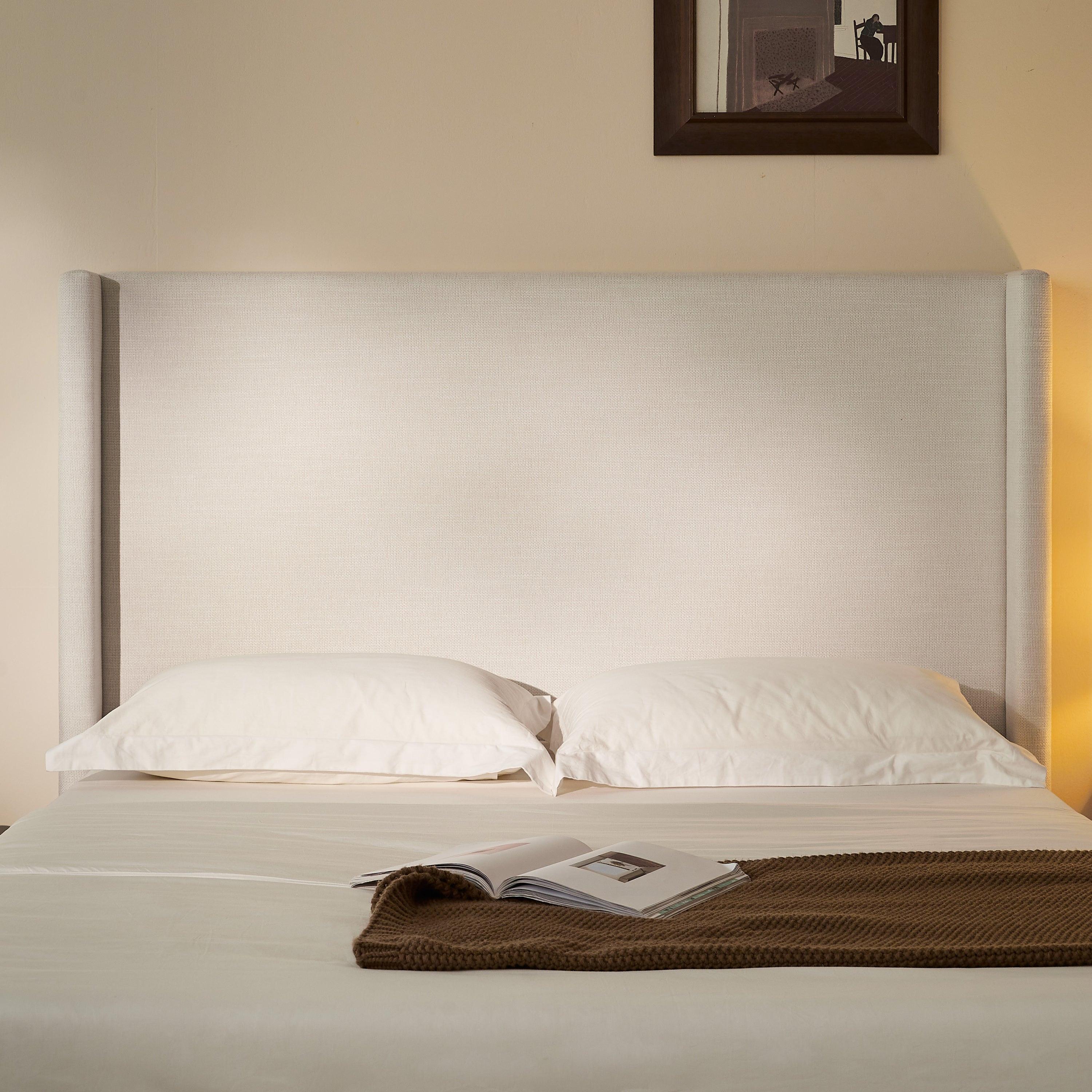 Hosford Minimalist Upholstered Wingback Bed.