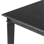 Close-up of table corner from retro dining set showing smooth oak veneer surface and detailed leg design for a refined dining experience.