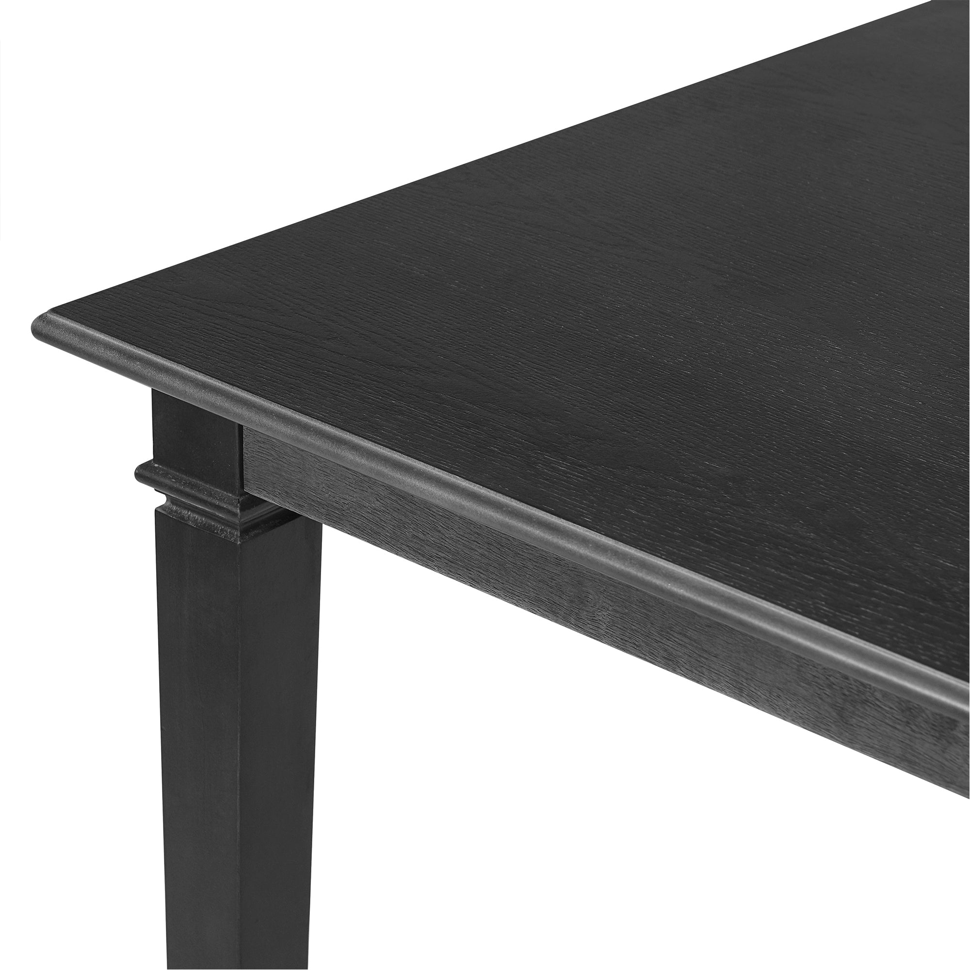 Close-up of table corner from retro dining set showing smooth oak veneer surface and detailed leg design for a refined dining experience.