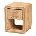 Boho-style natural rattan nightstand with a concentric coil drawer front, brass knob, and open storage cubby.