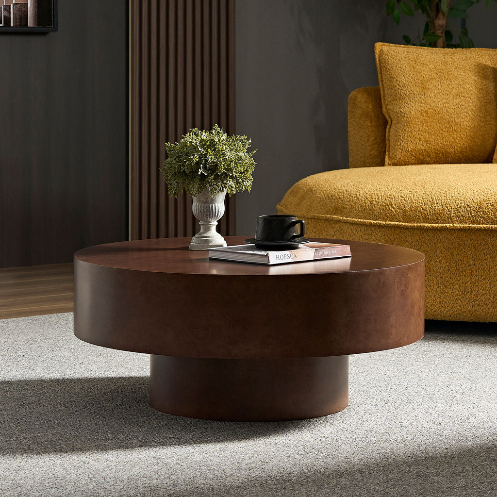 Modern Faux Burl Coffee Table with pedestal base placed in a stylish living room, highlighting its rich wood grain texture.