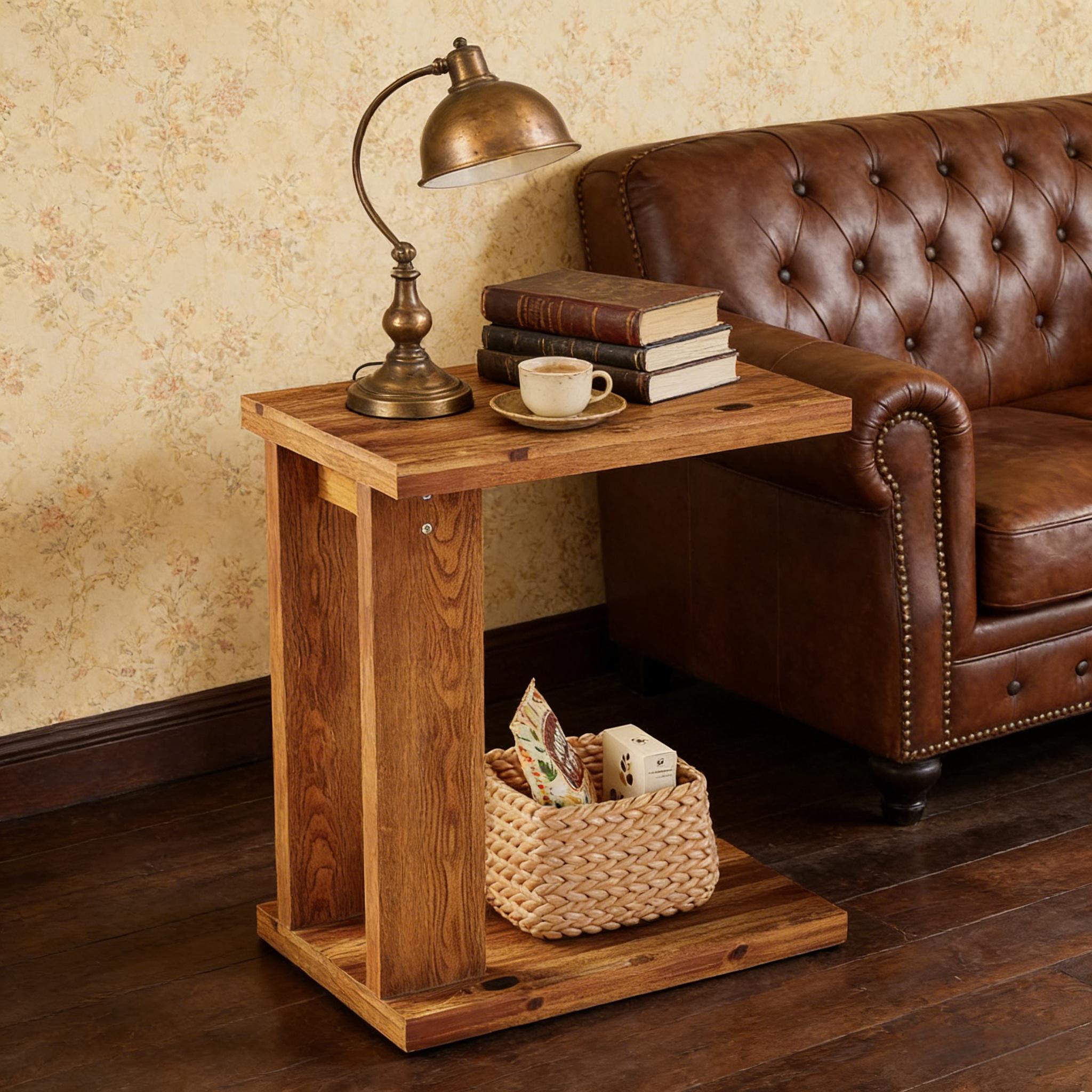 Rustic wooden C-shaped end table with a bottom storage shelf, styled next to a brown leather sofa.