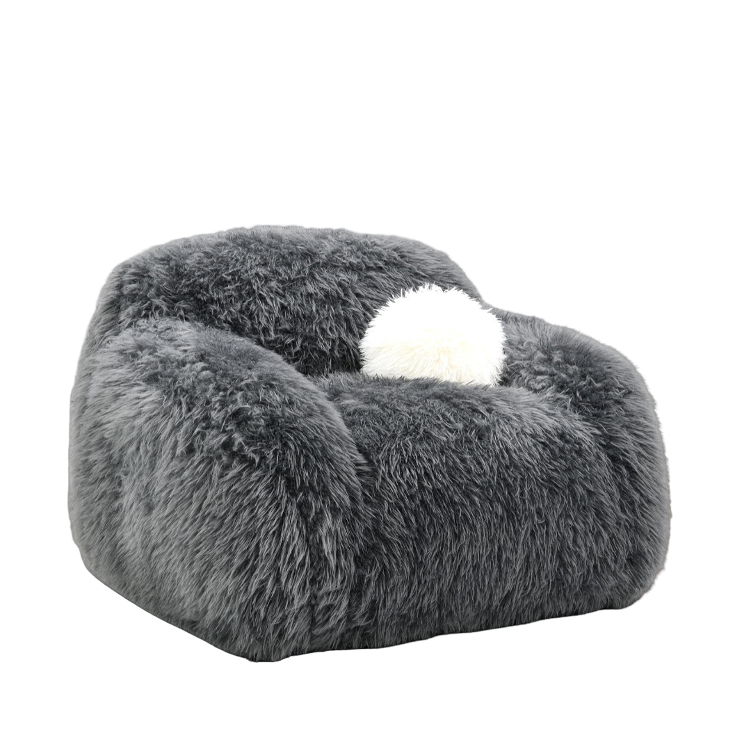Dark Gray Contemporary Accent Swivel Chair with plush faux fur and white pillow. Cozy and stylish seating for modern home decor.