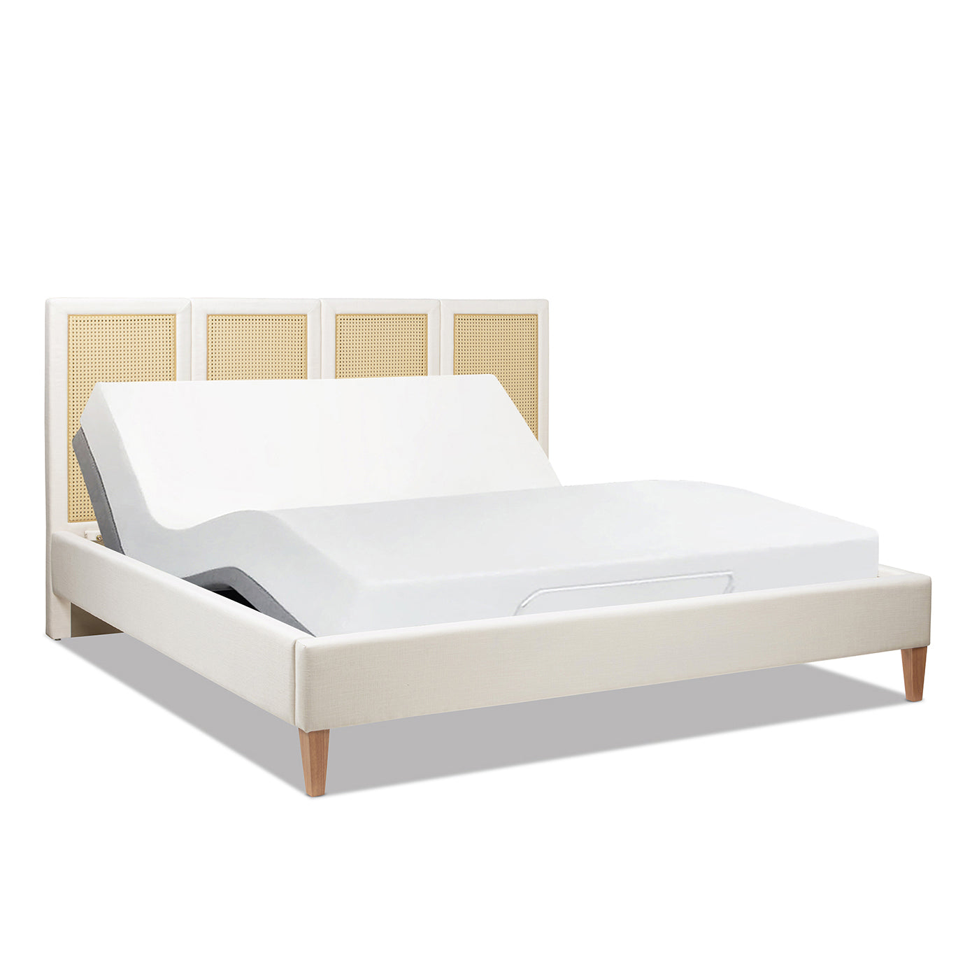 King Upholstered Cane Bed - Toscana compatible with adjustable base, shown in partially elevated position for ergonomic comfort.
