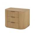 Modern light oak nightstand with a rounded silhouette, vertical fluted details, and three drawers with slim metal pulls.