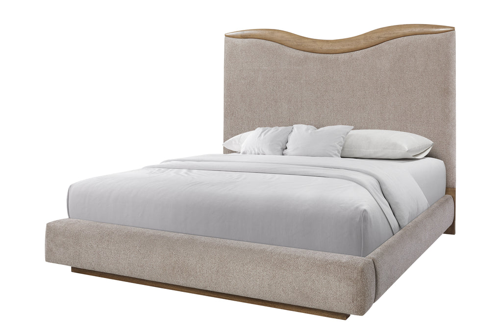 Side angle of upholstered queen bed with curved headboard and beige fabric frame, blending comfort and style for modern interiors.