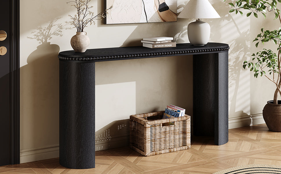 Angled view of Mirod Console Table showing its curved legs and beaded trim, styled in a cozy living space.