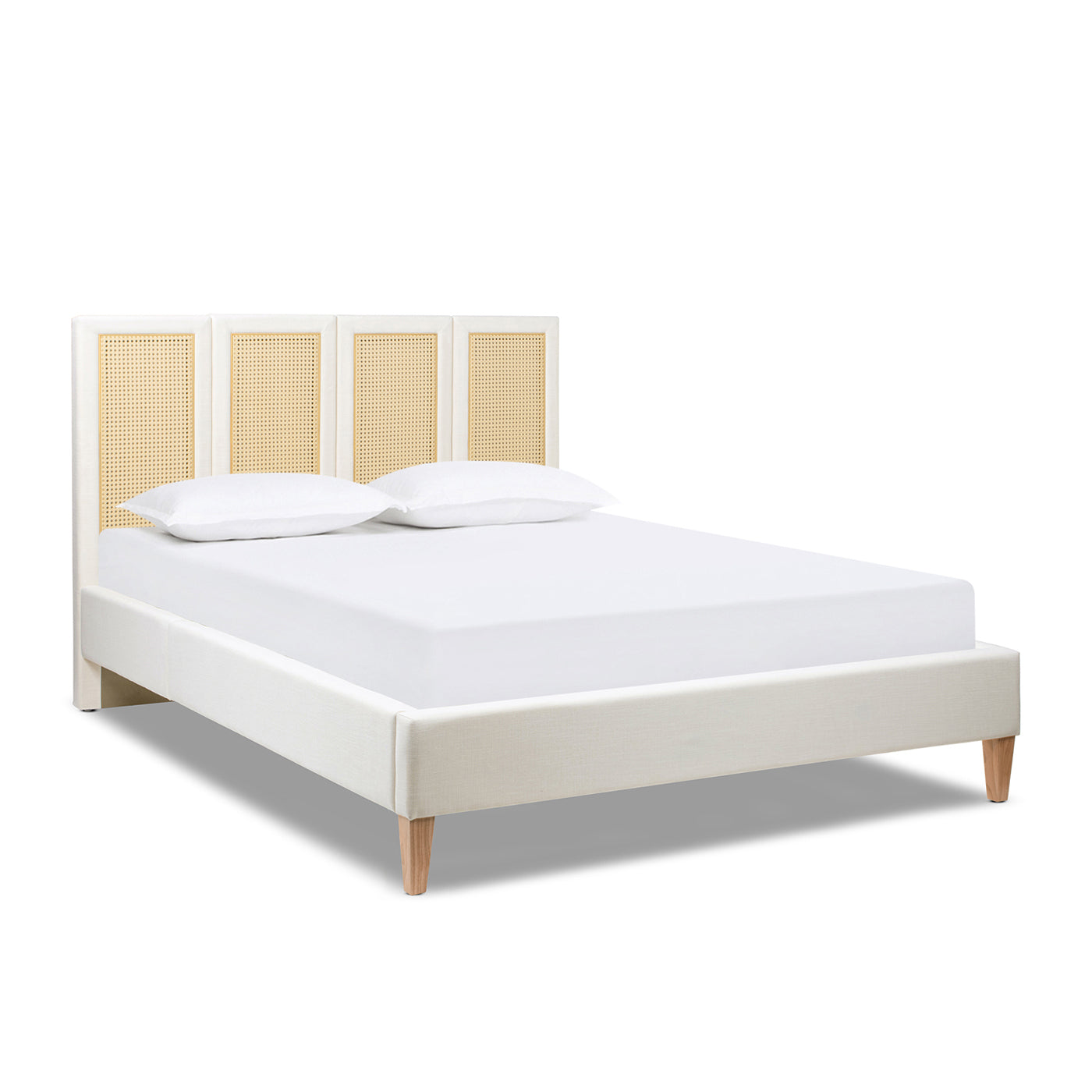Queen Upholstered Cane Bed frame in antique white with natural rattan headboard, shown without bedding to highlight structure and design.