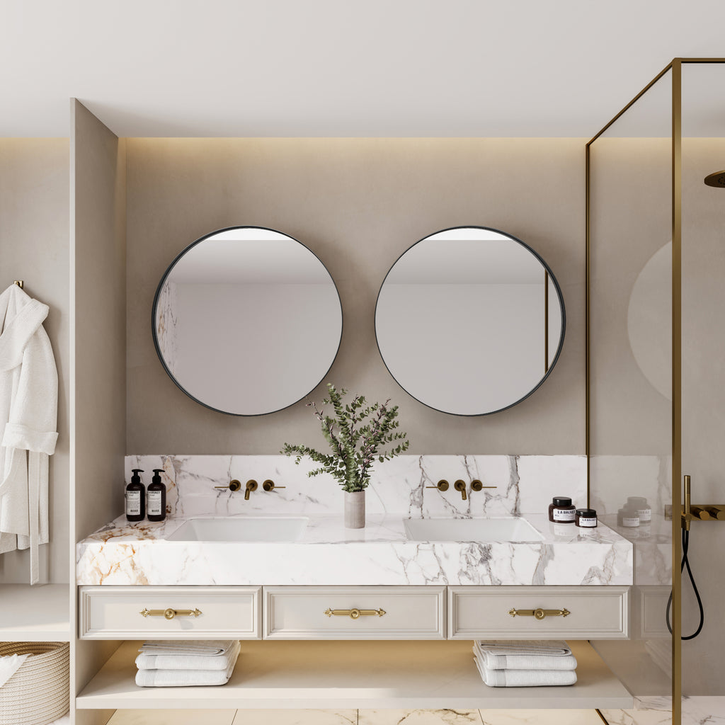 Double Round Black Metal Medicine Cabinets with Mirrors above a marble vanity in a luxury bathroom with gold accents.